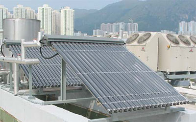 A small solar water heating installation at a fire station in Hong Kong. The text above describes the image.